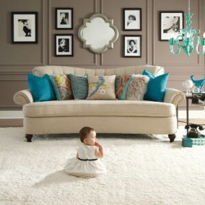 Cute baby on carpet flooring | Good Shepherd Flooring and Design Center