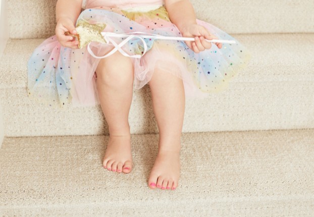 Baby sitting on carpet stairs | Good Shepherd Flooring and Design Center